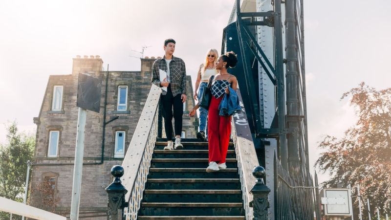 iQ students in edinburgh walking down stairs