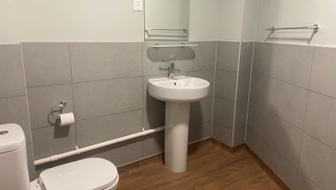 Separate shared toilet in addition to two shared shower rooms